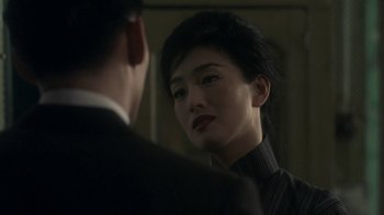 Movie still from “The Hand” (2004), directed by Kar-Wai Wong – A man and a woman looking at one another in a mirror; Close Up shot, Over the shoulder angle