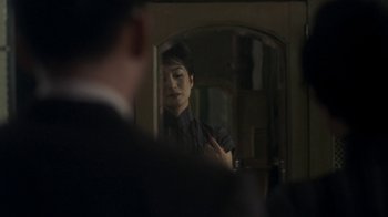 Movie still from “The Hand” (2004), directed by Kar-Wai Wong – A woman looking in the mirror in front of a man; Close Up shot, Over the shoulder angle