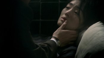 Movie still from “The Hand” (2004), directed by Kar-Wai Wong – A man touching the neck of a young woman; Close Up shot, Over the shoulder angle