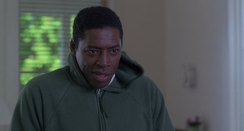 Movie still from “The Hand That Rocks the Cradle” (1992), directed by Curtis Hanson – A person wearing a green hoodie; Close Up shot, Over the shoulder angle