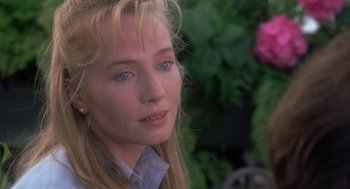 Movie still from “The Hand That Rocks the Cradle” (1992), directed by Curtis Hanson – A person with blue eyes; Close Up shot, Over the shoulder angle