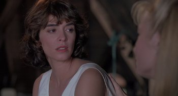 Movie still from “The Hand That Rocks the Cradle” (1992), directed by Curtis Hanson – A person wearing a white shirt; Close Up shot, Over the shoulder angle