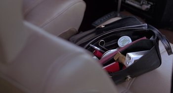 A bag full of personal care items sitting in a chair