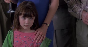 Movie still from “The Hand That Rocks the Cradle” (1992), directed by Curtis Hanson – A young girl with her arm around an older woman; Close Up shot, Over the shoulder angle