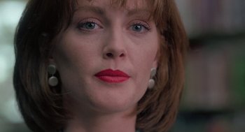 Movie still from “The Hand That Rocks the Cradle” (1992), directed by Curtis Hanson – A person with red lipstick; Close Up shot, Low angle