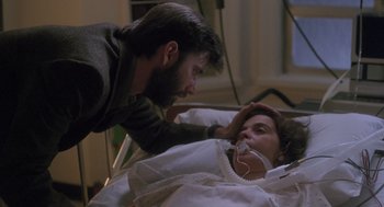 Movie still from “The Hand That Rocks the Cradle” (1992), directed by Curtis Hanson – A man and a woman in a hospital bed; Close Up shot, Over the shoulder angle