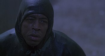 Movie still from “The Hand That Rocks the Cradle” (1992), directed by Curtis Hanson – A person wearing a hooded jacket; Close Up shot, Low angle