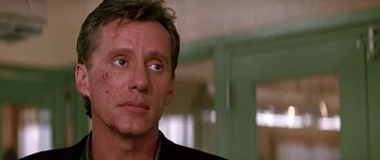Movie still from “The Hard Way” (1991), directed by John Badham – A person looking at the camera; Close Up shot, Over the shoulder angle