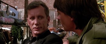 Movie still from “The Hard Way” (1991), directed by John Badham – A man and a woman talking to each other; Close Up shot, Over the shoulder angle