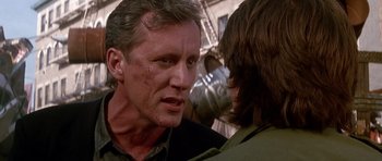 Movie still from “The Hard Way” (1991), directed by John Badham – A person talking to another person; Close Up shot, Over the shoulder angle