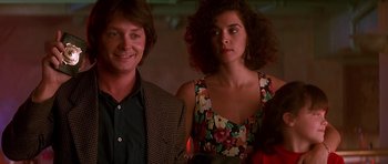 Movie still from “The Hard Way” (1991), directed by John Badham – A man and a woman standing next to each other; Close Up shot, Low angle