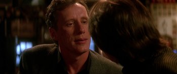 Movie still from “The Hard Way” (1991), directed by John Badham – A person talking to another person; Close Up shot, Over the shoulder angle