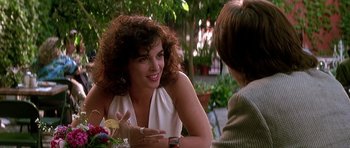 Movie still from “The Hard Way” (1991), directed by John Badham – Two women sitting at a table talking to each other; Close Up shot, Over the shoulder angle