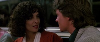 Movie still from “The Hard Way” (1991), directed by John Badham – A man and a woman talking to each other; Close Up shot, Over the shoulder angle