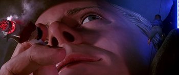 Movie still from “The Hard Way” (1991), directed by John Badham – View of the face of a statue; Extreme Close Up shot, Low angle