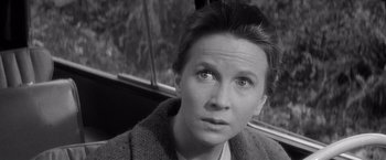 Movie still from “The Haunting” (1963), directed by Robert Wise – Black and white photograph of a woman looking at the camera; Close Up shot, High angle