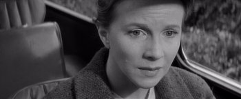 Movie still from “The Haunting” (1963), directed by Robert Wise – Black and white photograph of a woman looking at the camera; Close Up shot, High angle