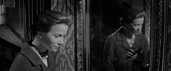 Movie still from “The Haunting” (1963), directed by Robert Wise – A black - and - white photo of a woman and a man; Close Up shot, Over the shoulder angle