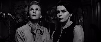 Movie still from “The Haunting” (1963), directed by Robert Wise – Two people standing next to each other in a room; Close Up shot, Low angle