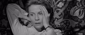 Movie still from “The Haunting” (1963), directed by Robert Wise – Black and white photograph of a woman with a hand on her face; Close Up shot, High angle