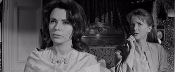 Movie still from “The Haunting” (1963), directed by Robert Wise – A black - and - white photo of a woman and a man; Close Up shot, Over the shoulder angle