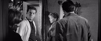 Movie still from “The Haunting” (1963), directed by Robert Wise – A man and a woman looking in a mirror; Medium shot, Over the shoulder angle