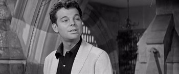 Movie still from “The Haunting” (1963), directed by Robert Wise – Black and white photograph of a man in a suit; Close Up shot, Low angle