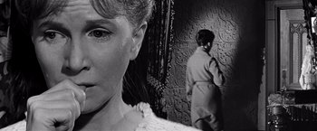Movie still from “The Haunting” (1963), directed by Robert Wise – A black - and - white photo of a woman and a man; Close Up shot, Over the shoulder angle
