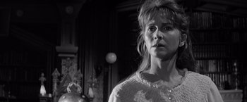 Movie still from “The Haunting” (1963), directed by Robert Wise – A black - and - white photo of a woman looking at the camera; Close Up shot, Low angle