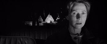 Movie still from “The Haunting” (1963), directed by Robert Wise – A man sitting in the back of a car at night; Close Up shot, Low angle