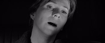 Movie still from “The Haunting” (1963), directed by Robert Wise – A black - and - white photo of a woman's face; Close Up shot, Overhead angle