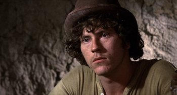 Movie still from “The Hired Hand” (1971), directed by Peter Fonda – A person wearing a hat; Close Up shot, Low angle