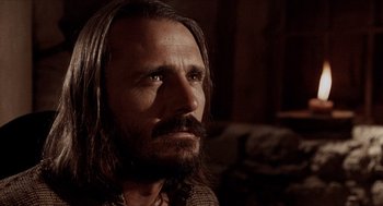 Movie still from “The Hired Hand” (1971), directed by Peter Fonda – A person with long hair and a beard; Close Up shot, Low angle