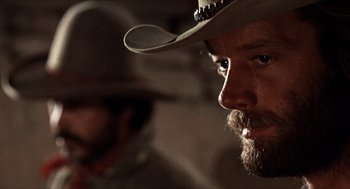 Movie still from “The Hired Hand” (1971), directed by Peter Fonda – A person wearing a cowboy hat; Close Up shot, Low angle