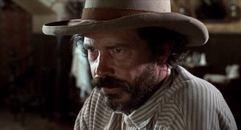 Movie still from “The Hired Hand” (1971), directed by Peter Fonda – A person wearing a hat; Close Up shot, Low angle