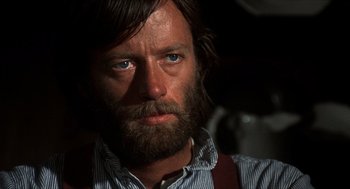 Movie still from “The Hired Hand” (1971), directed by Peter Fonda – A person with a beard; Close Up shot, Over the shoulder angle