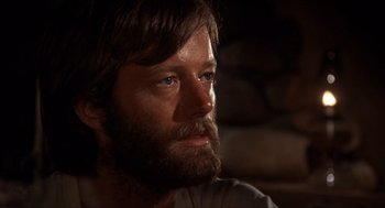 Movie still from “The Hired Hand” (1971), directed by Peter Fonda – A person with a beard; Close Up shot, Low angle