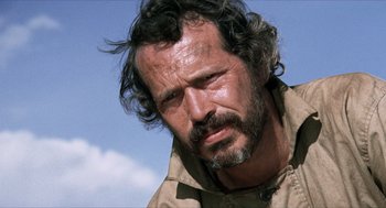 Movie still from “The Hired Hand” (1971), directed by Peter Fonda – A person wearing a jacket; Close Up shot, Low angle