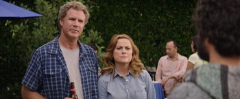 Movie still from “The House” (2017), directed by Andrew Jay Cohen – A man and a woman standing next to each other; Close Up shot, Over the shoulder angle