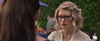 Movie still from “The House” (2017), directed by Andrew Jay Cohen – A woman wearing glasses talking to another woman; Close Up shot, Over the shoulder angle