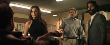 Movie still from “The House” (2017), directed by Andrew Jay Cohen – A man and a woman standing next to each other in a room; Medium shot, Over the shoulder angle