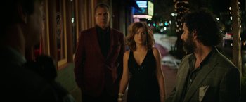 Movie still from “The House” (2017), directed by Andrew Jay Cohen – A man and a woman walking down a street at night; Medium shot, Over the shoulder angle