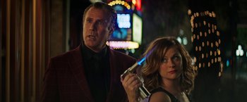 Movie still from “The House” (2017), directed by Andrew Jay Cohen – A man and a woman standing next to each other; Close Up shot, Over the shoulder angle