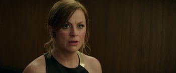 Movie still from “The House” (2017), directed by Andrew Jay Cohen – A person wearing a dress; Close Up shot, Over the shoulder angle