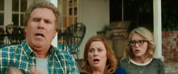 Movie still from “The House” (2017), directed by Andrew Jay Cohen – Two people are standing in front of each other; Close Up shot, Over the shoulder angle