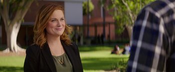 Movie still from “The House” (2017), directed by Andrew Jay Cohen – A person wearing a suit and tie; Medium shot, Over the shoulder angle