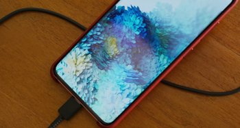 Movie still from “The Human Voice” (2020), directed by Pedro Almodóvar – The back side of a cell phone; Extreme Close Up shot, Overhead angle