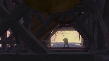 Movie still from “The Hunchback of Notre Dame” (1996), directed by Gary Trousdale – A man standing in a room under a structure; Extreme Wide shot, Low angle