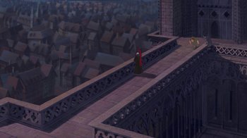 Movie still from “The Hunchback of Notre Dame” (1996), directed by Gary Trousdale – A person standing on a balcony looking out over a city; Extreme Wide shot, High angle