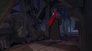 Movie still from “The Hunchback of Notre Dame” (1996), directed by Gary Trousdale – A cartoon character is standing in front of some statues; Wide shot, Over the shoulder angle